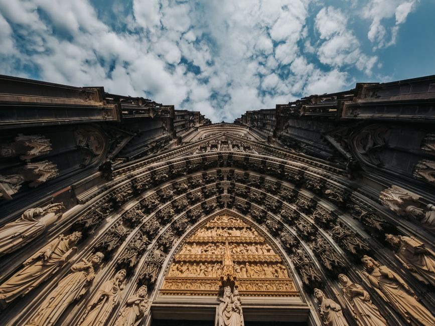 Explore the detailed Gothic facade of Cologne Cathedral, a testament to German craftsmanship.